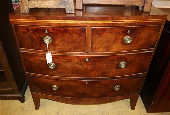 A Regency mahogany bow-fronted chest fitted two short drawers and two long drawers, on tapered feet, Width 90cm